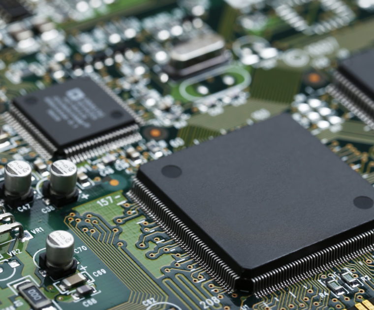 Closeup of electronic circuit board with CPU microchip electronic components background